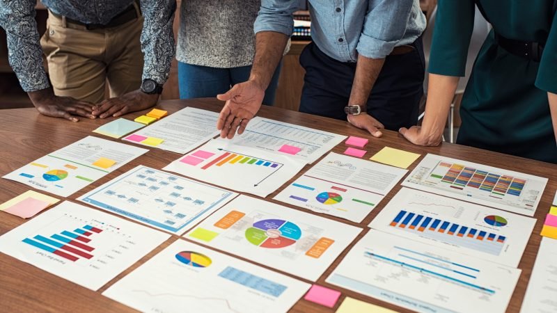 business casual team working on graphs